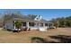 Well-maintained home featuring a cozy front porch with seating and attractive exterior details at 6118 Hazelhurst Ln, Ravenel, SC 29470