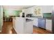 Bright kitchen with white cabinets, stainless steel appliances, and eat-in area at 6118 Hazelhurst Ln, Ravenel, SC 29470