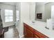 A bright bathroom with a modern sink, vanity, mirror, and tile flooring by the toilet at 613 Zinnia Dr, Goose Creek, SC 29445