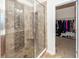 Shower with glass door and tile surround. Walk-in closet nearby at 613 Zinnia Dr, Goose Creek, SC 29445