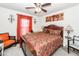 Cozy bedroom featuring a decorative ceiling fan, and a plush bed with warm, patterned bedding at 613 Zinnia Dr, Goose Creek, SC 29445