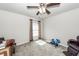 Simple bedroom with ceiling fan, natural light, and minimalist furnishings at 613 Zinnia Dr, Goose Creek, SC 29445