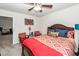 Bright bedroom with ceiling fan, bed with colorful bedding, and stylish decor at 613 Zinnia Dr, Goose Creek, SC 29445