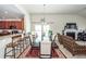 The spacious dining area features an expansive dining table, counter seating, and fireplace at 613 Zinnia Dr, Goose Creek, SC 29445