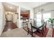 Bright dining area featuring a breakfast bar, stylish table set and open concept design at 613 Zinnia Dr, Goose Creek, SC 29445