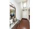 Welcoming foyer featuring hardwood floors, a mirror, decorations, and a tall ceiling at 613 Zinnia Dr, Goose Creek, SC 29445