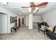 Bright upstairs hallway features a study area, multiple doors, and ceiling fan with lighting at 613 Zinnia Dr, Goose Creek, SC 29445