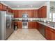 Well-equipped kitchen with stainless steel appliances, ample counter space, and rich wood cabinetry at 613 Zinnia Dr, Goose Creek, SC 29445