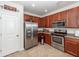 Well-equipped kitchen featuring stainless steel appliances and wood cabinets and countertops at 613 Zinnia Dr, Goose Creek, SC 29445