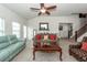 Bright living room with comfortable seating, ceiling fan, and stylish accents at 613 Zinnia Dr, Goose Creek, SC 29445
