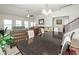 Bright, open-concept living space featuring a large dining table and abundant natural light at 613 Zinnia Dr, Goose Creek, SC 29445