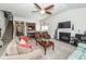 Spacious living area with a fireplace, large sofa, ceiling fan, and staircase at 613 Zinnia Dr, Goose Creek, SC 29445