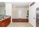 Open-concept area featuring tile and hardwood floors, offering ample space at 613 Zinnia Dr, Goose Creek, SC 29445