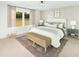 Serene bedroom with a large window, neutral tones, panel moulding, and stylish decor at 5215 Cottage Lndg Dr, Summerville, SC 29485