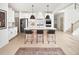 Stylish kitchen with white cabinets, stainless steel appliances, and an island with seating at 5215 Cottage Lndg Dr, Summerville, SC 29485