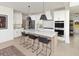 Beautiful kitchen with white cabinetry, stainless steel appliances, island with seating and view to the back yard at 5215 Cottage Lndg Dr, Summerville, SC 29485