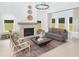 Bright living room features a fireplace, tall ceilings, and lots of natural light at 5215 Cottage Lndg Dr, Summerville, SC 29485