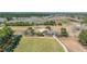 An aerial view of the surrounding landscape showcasing the property, long driveway, and greenery around the home at 732 Lindhaven Dr, Pineville, SC 29468