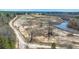 Scenic aerial view of expansive land featuring a meandering stream and open fields ready for development at 732 Lindhaven Dr, Pineville, SC 29468