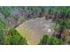 Aerial view highlighting a barren field, ready for planting, development, or other agricultural pursuits at 732 Lindhaven Dr, Pineville, SC 29468