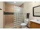 Bathroom featuring glass block shower, tile surround, toilet, and vanity at 732 Lindhaven Dr, Pineville, SC 29468