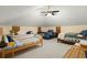 Spacious bedroom with multiple beds, ceiling fan, and neutral carpeting for comfortable living at 732 Lindhaven Dr, Pineville, SC 29468