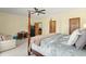 Large bedroom featuring a four-poster bed, desk, and en-suite bath at 732 Lindhaven Dr, Pineville, SC 29468