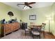Dining area featuring hardwood floors, ceiling fan, and vintage wooden furniture at 732 Lindhaven Dr, Pineville, SC 29468