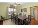 Dining room featuring a wooden table set with upholstered chairs, complemented by natural lighting at 732 Lindhaven Dr, Pineville, SC 29468
