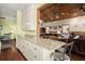 Kitchen counter with granite countertop, adjoining living room with wood ceiling at 732 Lindhaven Dr, Pineville, SC 29468