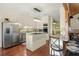 Bright kitchen showcasing stainless steel appliances, granite countertops, and a center island at 732 Lindhaven Dr, Pineville, SC 29468