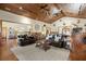 Spacious living room boasting hardwood floors and wood ceiling adjoining a kitchen area at 732 Lindhaven Dr, Pineville, SC 29468