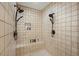 Spacious shower with dual shower heads, built-in bench, and tiled walls at 732 Lindhaven Dr, Pineville, SC 29468