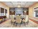 Elegant dining room with a round table, fireplace, and classic decor for sophisticated gatherings at 747 Spinnaker Beachhouse, Seabrook Island, SC 29455