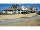 Luxurious estate boasting manicured lawns, lush landscaping, and elegant architectural details, perfect for upscale living at 747 Spinnaker Beachhouse, Seabrook Island, SC 29455