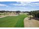 Beautiful green golf course featuring a well-maintained fairway on a sunny day at 747 Spinnaker Beachhouse, Seabrook Island, SC 29455
