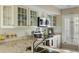 Bright kitchen featuring stainless steel appliances, subway tile backsplash and granite countertop at 747 Spinnaker Beachhouse, Seabrook Island, SC 29455