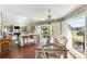 Open concept living room and dining area with large windows, creating a bright and inviting space at 747 Spinnaker Beachhouse, Seabrook Island, SC 29455