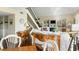 Inviting living space with hardwood floors, fireplace, built-ins, and staircase at 747 Spinnaker Beachhouse, Seabrook Island, SC 29455