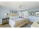 Bedroom features a light blue color scheme, ceiling fan, and furniture with light wood trim at 747 Spinnaker Beachhouse, Seabrook Island, SC 29455