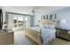 Bedroom features a light blue color scheme, ceiling fan, and furniture with light wood trim at 747 Spinnaker Beachhouse, Seabrook Island, SC 29455