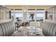 Dining area showcasing ocean views through large windows, elegant seating, and a relaxed ambiance at 747 Spinnaker Beachhouse, Seabrook Island, SC 29455