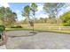 Spacious backyard with a stone patio, lush lawn, and mature trees, great for outdoor living and entertaining at 779 Hamlet Cir, Goose Creek, SC 29445
