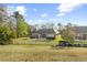 Aerial view of the home's backyard, featuring a white picket fence and a large patio at 779 Hamlet Cir, Goose Creek, SC 29445