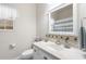 Bright bathroom with single sink vanity, mirror, and tub with curtain at 779 Hamlet Cir, Goose Creek, SC 29445