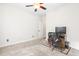 Neutral bedroom featuring desk with chair and tv, carpet and closet at 779 Hamlet Cir, Goose Creek, SC 29445