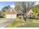 Beautiful brick home with lush green lawn and attractive landscaping, highlighting its curb appeal at 779 Hamlet Cir, Goose Creek, SC 29445