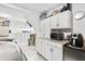 Well-organized garage with ample storage space, cabinets, and modern appliances for convenience at 779 Hamlet Cir, Goose Creek, SC 29445