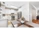 Spacious eat-in kitchen boasts stainless appliances, white cabinets, and tiled flooring at 779 Hamlet Cir, Goose Creek, SC 29445