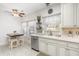 Bright eat-in kitchen features an island with seating, stainless appliances, and tiled backsplash at 779 Hamlet Cir, Goose Creek, SC 29445